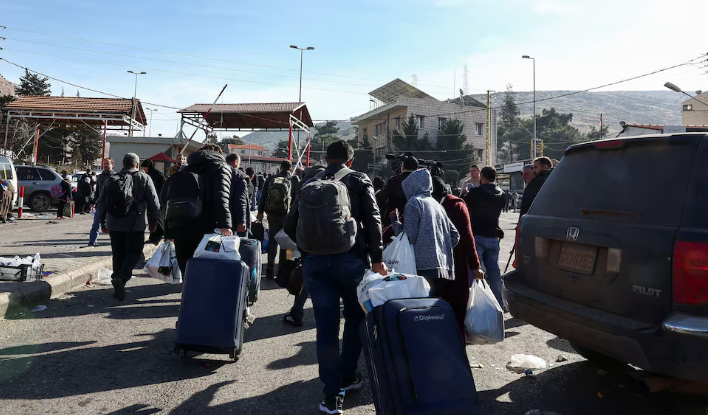 After the appointment of a caretaker prime minister, refugees return to Syria