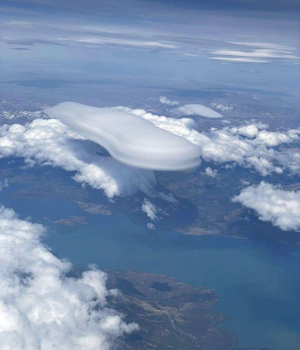 A lenticular cloud photographed from an airplane